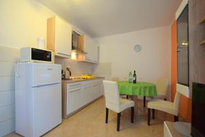 Kuchyň nebo kuchyňský kout v ubytování Apartments Cindric