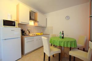 Kuchyň nebo kuchyňský kout v ubytování Apartments Cindric