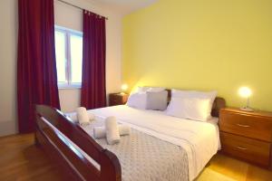 Postel nebo postele na pokoji v ubytování Apartments Cindric