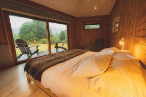Ліжко або ліжка в номері Peuma Lodge Patagonia