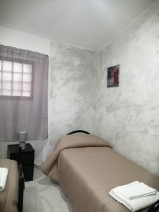 Posteľ alebo postele v izbe v ubytovaní Case Serena vacanze relax
