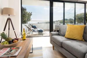 a living room with a couch and a table at 3 The Bay in Coldingham