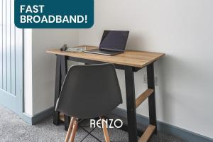 a laptop computer sitting on top of a desk at Incredible 1-bed Apartment in Derby by Renzo, Central Location! in Derby