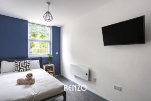 a bedroom with a bed and a flat screen tv at Incredible 1-bed Apartment in Derby by Renzo, Central Location! in Derby