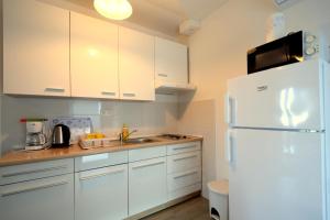 Kuchyň nebo kuchyňský kout v ubytování Apartments Cindric