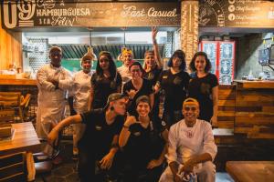 a group of people posing for a picture in a restaurant at Hotel El Peñon by Bithotels in Cali