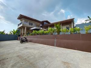 a motorcycle parked in front of a house at Villa Cisarua Ananda in Brujul