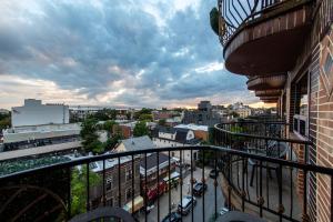 a balcony with a view of a city at The Avenue Plaza in Brooklyn