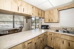 A kitchen or kitchenette at Tropical Indian Rocks Beach Suite A