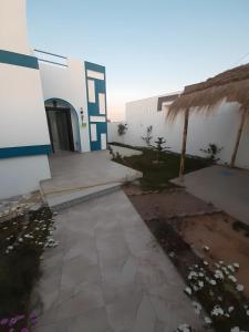 a view of a building with a patio at Villa Maria & Nour in Awlād ‘Umar