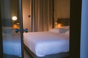 Postel nebo postele na pokoji v ubytování Villa Grumolara & Spa