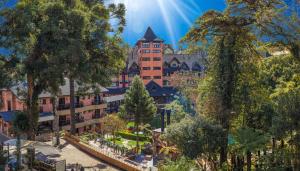 a resort with a large building in the background at Hotel Recanto da Serra in Gramado