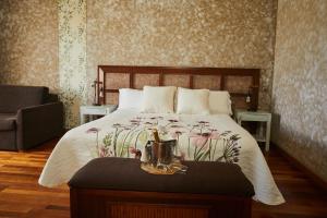 Voodi või voodid majutusasutuse Hotel El Mirlo Blanco toas