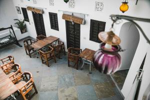 an overhead view of a patio with tables and chairs at Mosaics Guest House in Jaipur