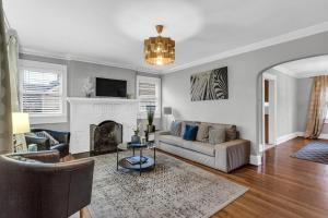 a living room with a couch and a fireplace at Southern Comfort in Atlanta