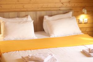 Postel nebo postele na pokoji v ubytování Mestia Villas
