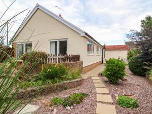 a house with a garden in front of it at Beach Retreat in Prestatyn