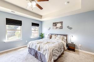 a bedroom with a bed and a ceiling fan at Greene Haven in Atlanta