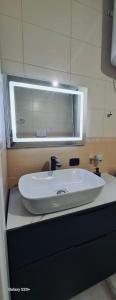 Ванная комната в Avi - Daily Rent Apartment