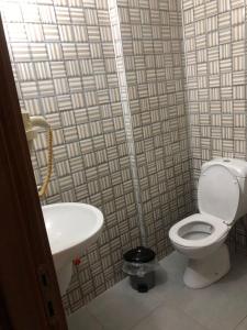 a bathroom with a toilet and a sink at Anamur Butik Otel in Anamur