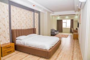 Кровать или кровати в номере Itten Plaza Hotel 2