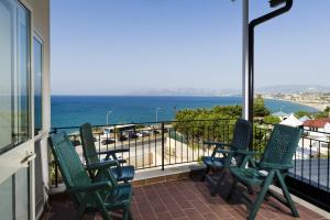 a balcony with chairs and a view of the ocean at Appartamento sul mare in Castellammare del Golfo +6 photos