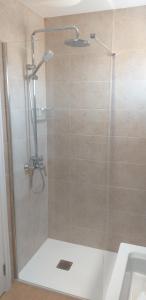 a shower with a glass door in a bathroom at SunnyDaze in Tías