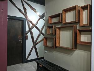 a room with wooden cabinets on a wall with a door at OYO 90863 Hi Inn 2 in Sibu