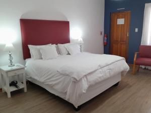 Postel nebo postele na pokoji v ubytování Obesa Lodge