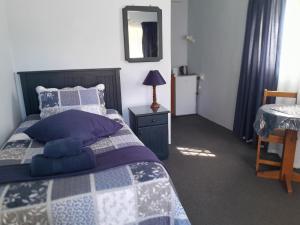 Postel nebo postele na pokoji v ubytování Obesa Lodge