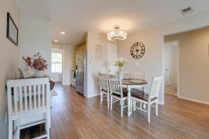 a dining room and kitchen with a table and chairs at Brandon Condo with Balcony, Strip and Mountain Views! in Branson
