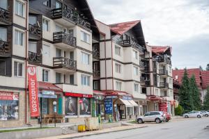 a row of apartment buildings on a city street at All Seasons Apartments Iglika 2 in Borovets