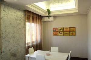 a dining room with a table and a window at Capital House Roma in Rome