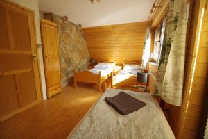 Posteľ alebo postele v izbe v ubytovaní Ski House Szczyrk - Solisko
