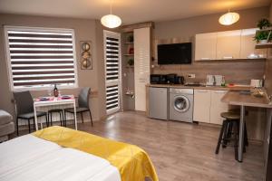 a room with a kitchen and a living room at All Seasons Apartments Iglika 2 in Borovets