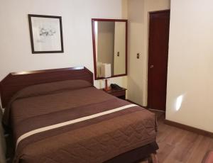 Postel nebo postele na pokoji v ubytování Hotel Alcala del Rio