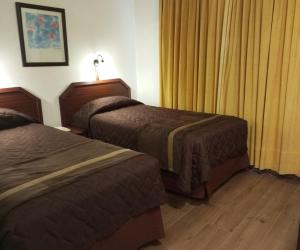 Postel nebo postele na pokoji v ubytování Hotel Alcala del Rio
