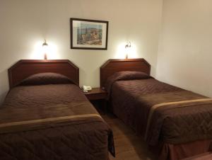 Postel nebo postele na pokoji v ubytování Hotel Alcala del Rio