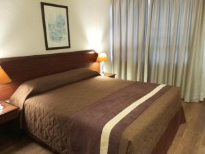 Postel nebo postele na pokoji v ubytování Hotel Alcala del Rio