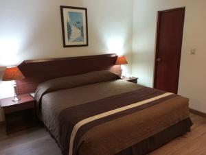 Postel nebo postele na pokoji v ubytování Hotel Alcala del Rio