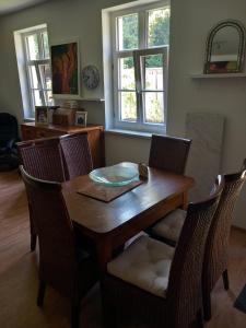 a dining room with a wooden table and chairs at Appartement für 4 Personen in Nürnberg in Nürnberg