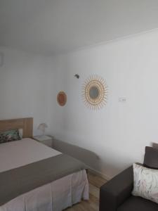 Ένα ή περισσότερα κρεβάτια σε δωμάτιο στο Casinha2