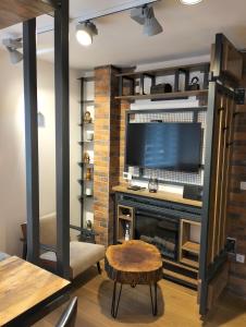 a living room with a fireplace and a television at Matrix in Jahorina +32 photos
