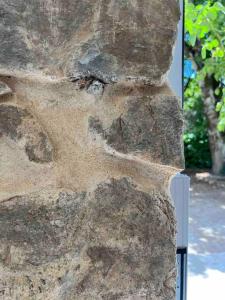 a close up of the side of a large rock at LesCinqSuites / Le Chivas - DABNB in Limoges +4 photos