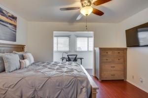 a bedroom with a bed and a ceiling fan at Modern Hawthorne Apartment Near SoFi Stadium in Hawthorne