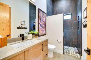 a bathroom with a sink and a toilet at Rock Creek Retreat Creekside Cabin Near Red Lodge in Red Lodge +23 photos