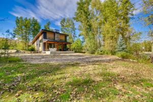 a home in the woods with a large yard at Rock Creek Retreat Creekside Cabin Near Red Lodge in Red Lodge