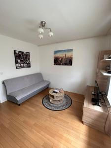 a living room with a couch and a table at Apartman Bruna in Zagreb