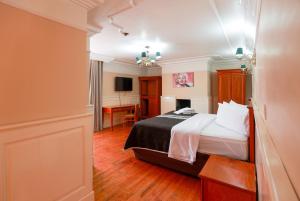 Säng eller sängar i ett rum på Hotel Real Del Monte