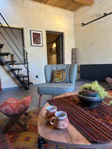 a living room with a table and a couch at Casa Chilai Cappadocia in Urgup